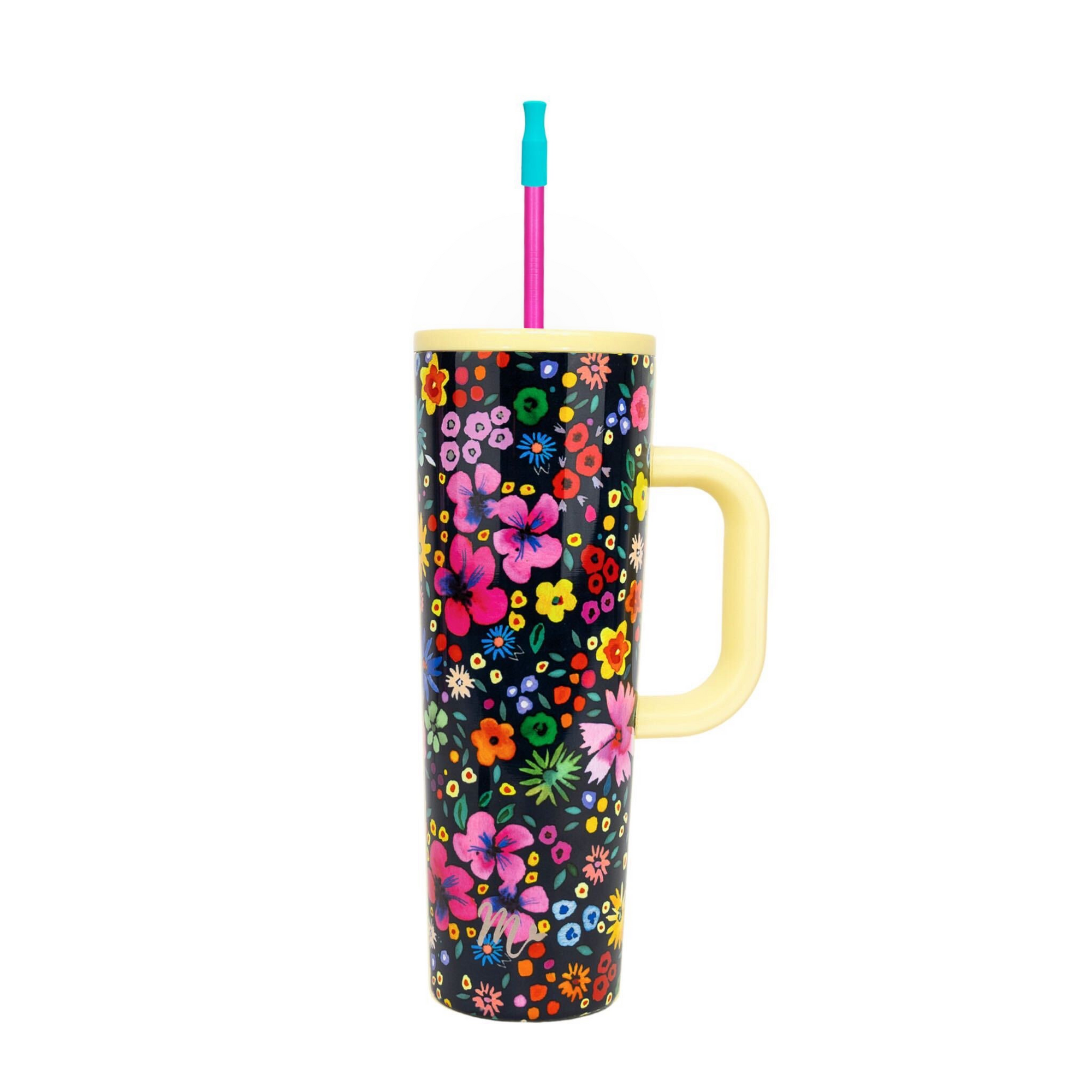 30oz tumbler with a vibrant ditzy floral design featuring colorful flowers on a dark background, a yellow handle, and a pink straw with a teal silicone tip. The tumbler combines style and functionality for a bold, cheerful look.